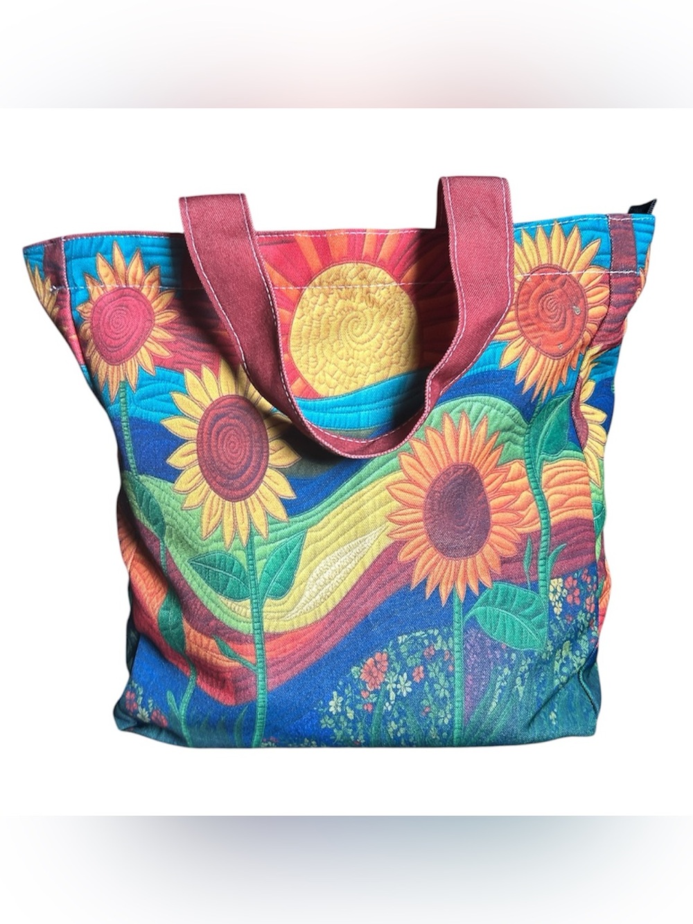 Vibrant colorful sunflower canvas tote bag features a sun and floral design. New